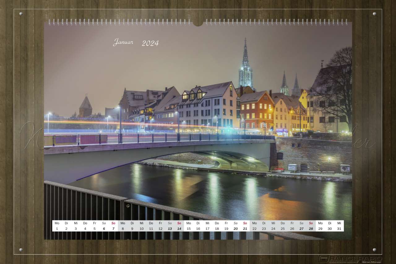 Über die Donau von Neu-Ulm aus mit der Herdbrücke im Vordergrund - Monat Januar: Wandkalender Ulm 2024 in Fine Art