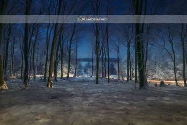 The Teutoburg forest at night covered with snow, recreational area in Lower Saxony near Osnabrück.